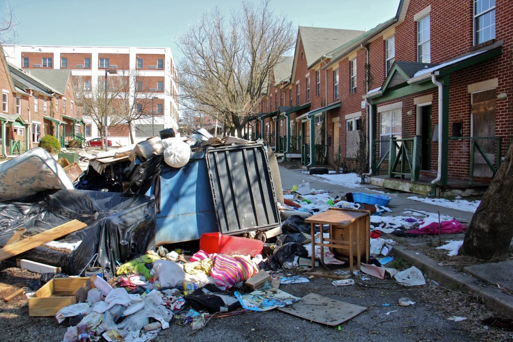 IMG_6798 Garbage is piled in front of an apartment complex in Lower Germantown. (Emma Lee/WHYY)
