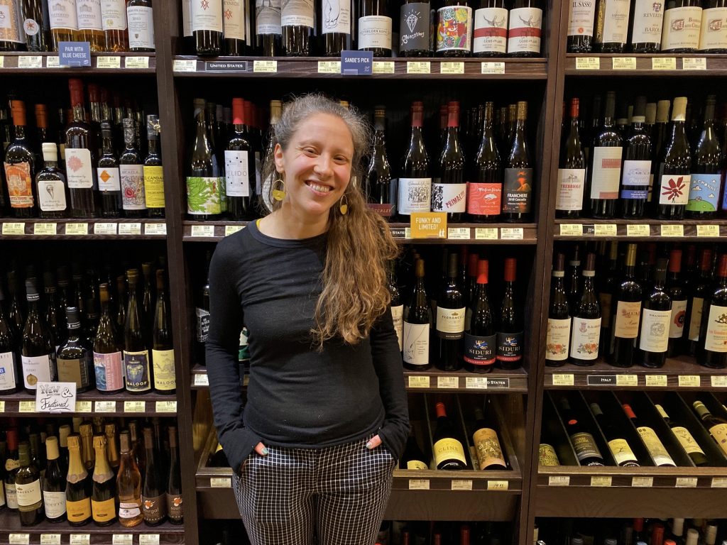 2020 01 09-a stern-sande friedman-philadelphia di bruno bros rittenhouse-wine buyer Sande Friedman, the wine buyer at Di Bruno Bros., stands in front of the stock at their Rittenhouse location. (Alex Stern/WHYY)