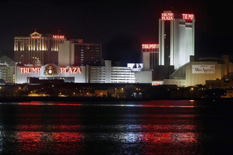 The Trump Plaza Hotel Casino is illuminated at night, just two weeks before closing on Sept. 16, 2014, in Atlantic City, N.J. (AP Photo/Mel Evans,file)