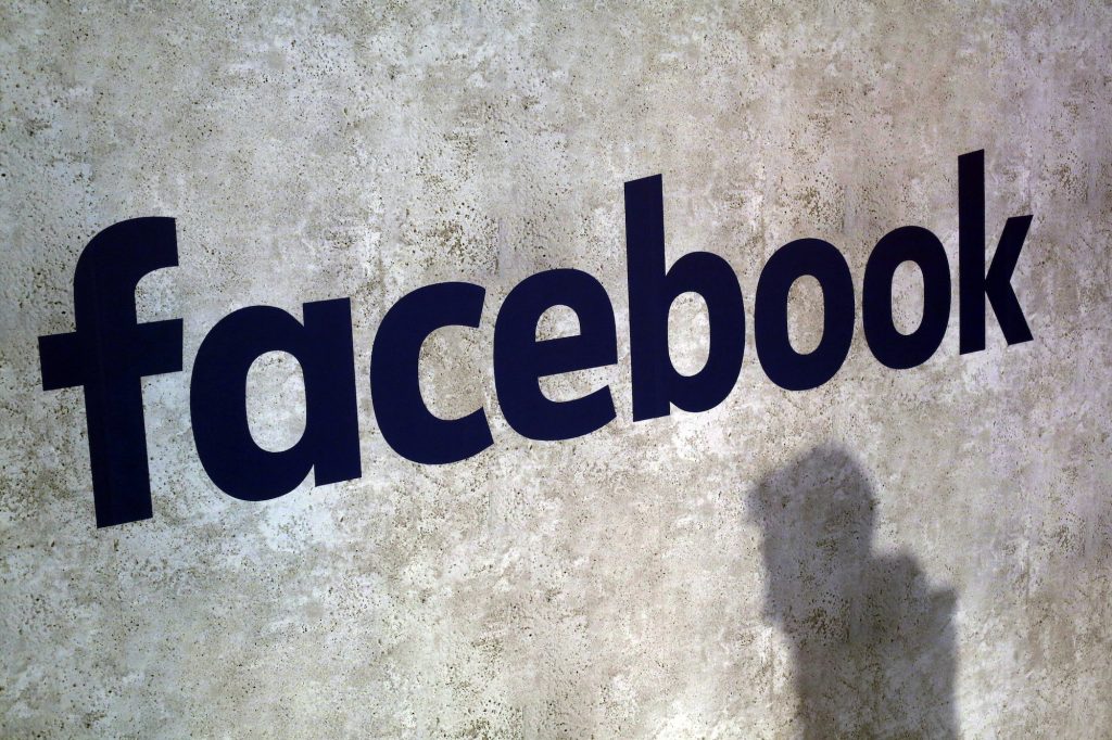 Facebook Political Ads This Jan. 17, 2017, file photo shows a Facebook logo being displayed in a start-up companies gathering at Paris' Station F in Paris. (Thibault Camus/AP Photo)
