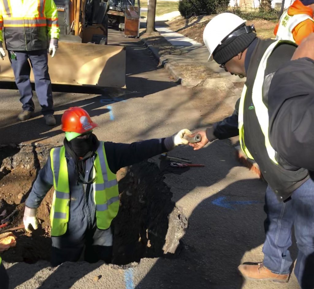Lead Water Pipes New Jersey A worker hands a piece of lead pipe to a colleague as they work to remove water service lines Thursday, Jan. 9, 2020, in Trenton, N.J. The city announced it is replacing 37,000 lead pipes over five years as part of an an effort to remove the potentially harmful pipes. (Mike Catalini/AP Photo)