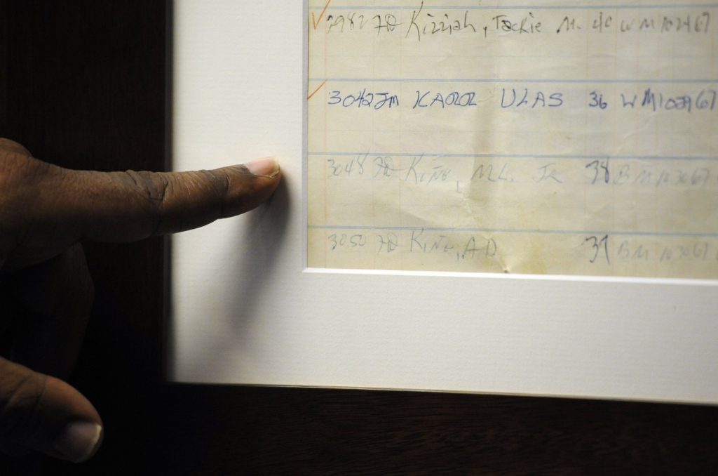 MLK-Alabama Jail Jefferson County Sheriff Mark Pettway points out an old jail log showing the name of Dr. Martin Luther King Jr. in Birmingham, Ala. (Jay Reeves/AP Photo)