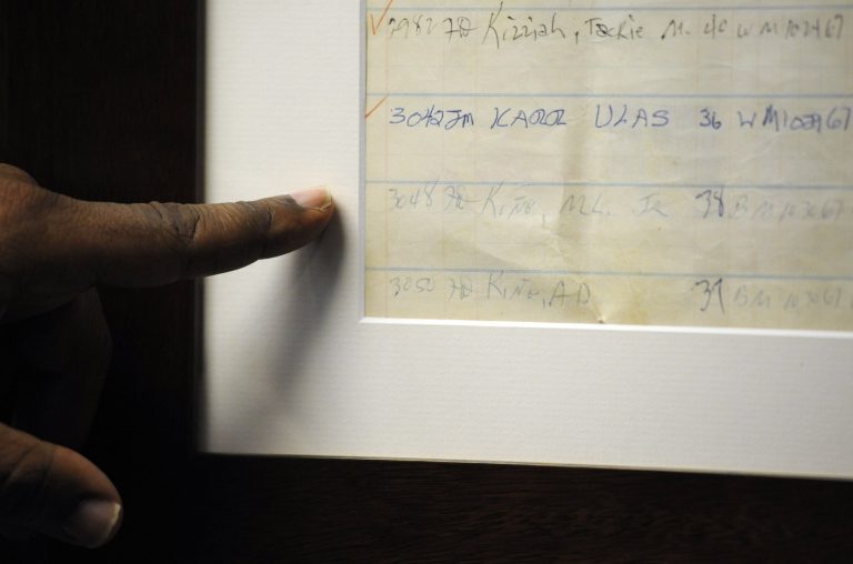 Jefferson County Sheriff Mark Pettway points out an old jail log showing the name of Dr. Martin Luther King Jr. in Birmingham, Ala. (Jay Reeves/AP Photo)