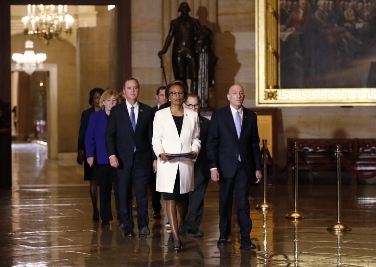 House Sergeant at Arms Paul Irving and Clerk of the House Cheryl Johnson deliver the articles of impeachment against President Donald Trump on Capitol Hill in Washington, Wednesday, Jan. 15, 2020. Following are impeachment managers, Rep. Jerrold Nadler, D-N.Y., Adam Schiff, D-Calif., Rep. Hakeem Jeffries, D-N.Y., Rep. Sylvia Garcia, D-Texas, Rep. Val Demings, D-Fla., Rep. Zoe Lofgren, D-Calif., and Rep. Jason Crow, D-Colo. (AP Photo/Julio Cortez)