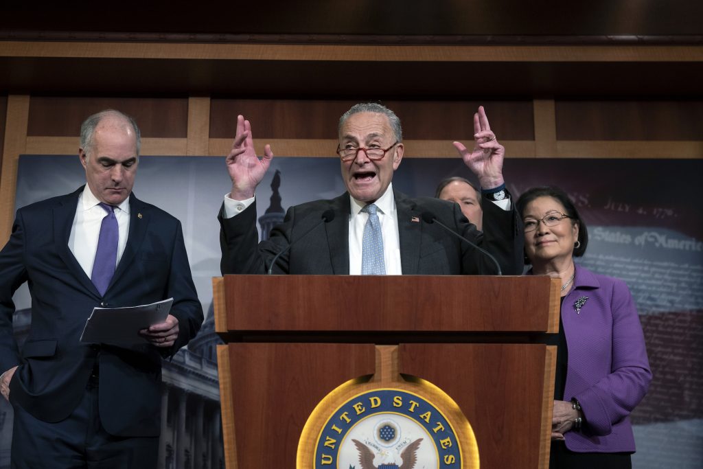 Chuck Schumer,Bob Casey,Tom Udall,Mazie Hirono Senate Minority Leader Chuck Schumer, D-N.Y., joined from left by Sen. Bob Casey, D-Pa., Sen. Tom Udall, D-N.M., and Sen. Mazie Hirono, D-Hawaii, speaks to reporters about progress in the impeachment trial of President Donald Trump on charges of abuse of power and obstruction of Congress, at the Capitol in Washington, Thursday, Jan. 23, 2020. (AP Photo/J. Scott Applewhite)