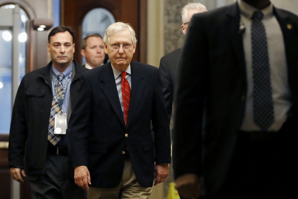 Mitch Mconnell Senate Majority Leader Mitch McConnell of Ky., center, arrives at the Capitol in Washington during the impeachment trial of President Donald Trump on charges of abuse of power and obstruction of Congress, Saturday, Jan. 25, 2020. (Julio Cortez/AP Photo)