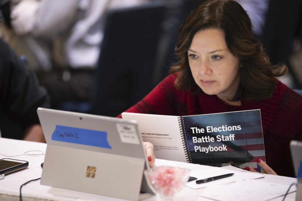 Mandy Vigil Mandy Vigil, from New Mexico, works during an exercise run by military and national security officials, for state and local election officials to simulate different scenarios for the 2020 elections, Monday, Dec. 16, 2019, in Springfield, Va. (Alex Brandon/AP Photo)