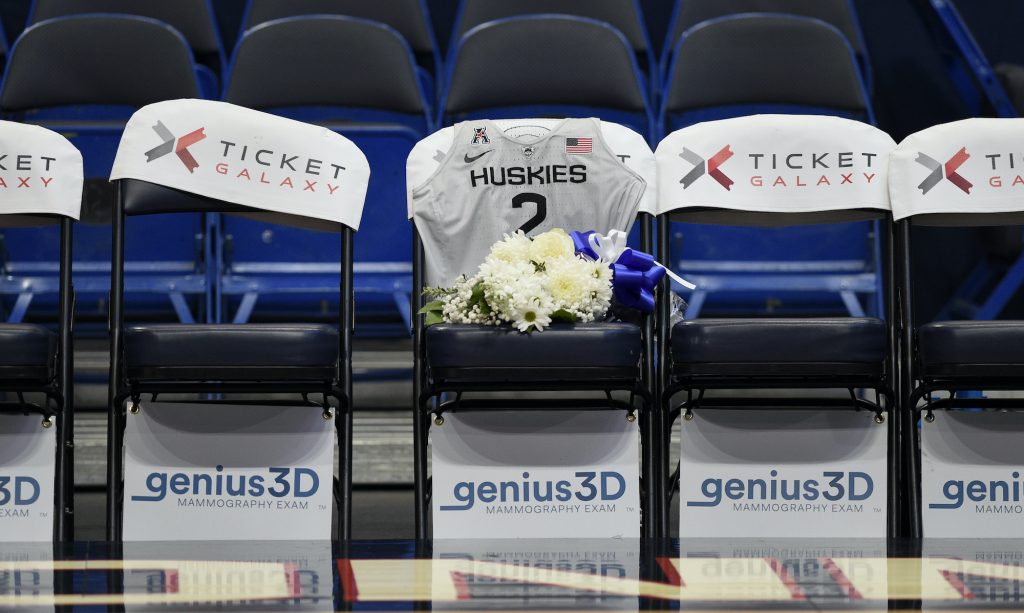 US UConn Basketball Bryant A seat with a jersey and flowers is reserved in memory of Gianna Bryant before an exhibition basketball game in the first half of a basketball game against the US, Monday, Jan. 27, 2020, in Hartford, Conn. Bryant was going to play at Connecticut and head to the WNBA. That was the plan. Her promising life came to a shocking, sudden and sad end Sunday, Jan. 26, 2020 along with her father Kobe. They died in a helicopter crash in California along with seven others. (AP Photo/Jessica Hill)