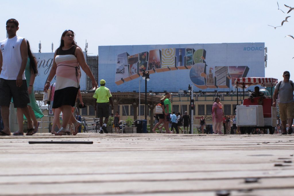 Atlantic City Casino Leadership This July 3, 2015 photo shows people walking on the Boardwalk in Atlantic City N.J. On Jan. 30, 2020, top executives from eight of the city's nine casinos said Atlantic City needs to be cleaned up and made safer before business conditions will improve. (Wayne Parry/AP Photo)