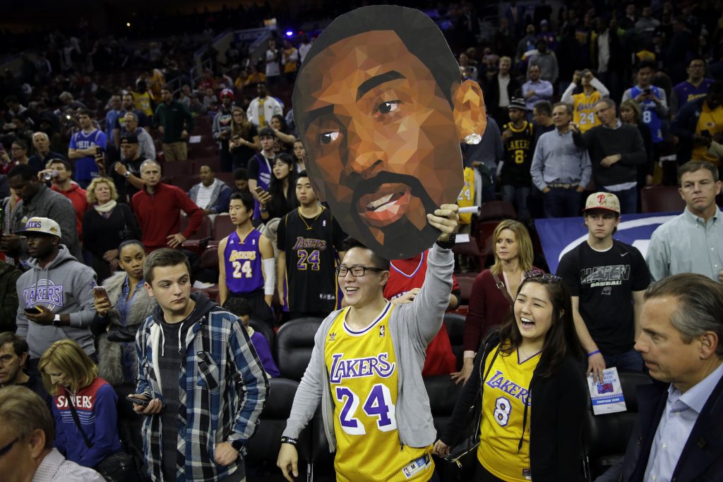 Lakers 76ers Basketball Fans of Los Angeles Lakers' Kobe Bryant watch him practice ahead of a basketball game against the Philadelphia 76ers Tuesday, Dec. 1, 2015, in Philadelphia. (AP Photo/Matt Rourke)