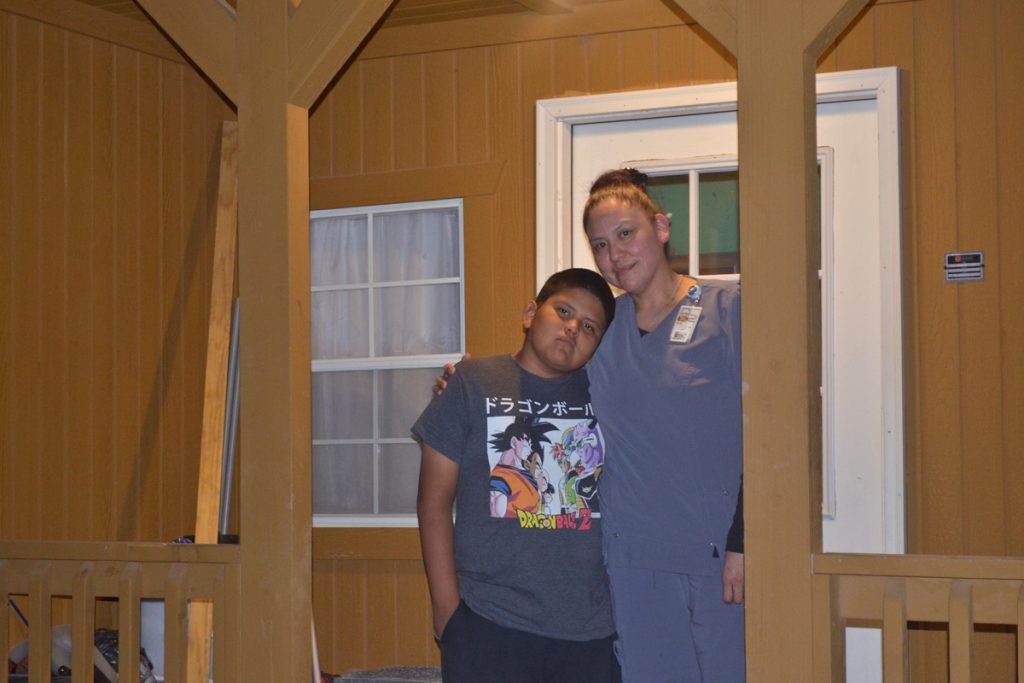 Chelsea and Ethan Holtsoi Many Farms Navajo Reservation Chelsea and Ethan Holtsoi in front of their cabin near Many Farms on the Navajo Reservation. (Eilís O’Neill/For WHYY)