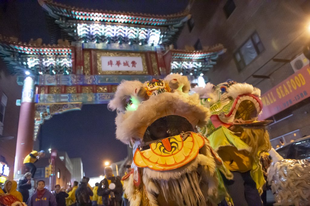 CHINESE NEW YEAR 2020 Lion dancers from the Philadelphia Suns perform in front of the Chinese Friendship Gate in Chinatown celebrating the Lunar New Year. (Jonathan Wilson for WHYY)