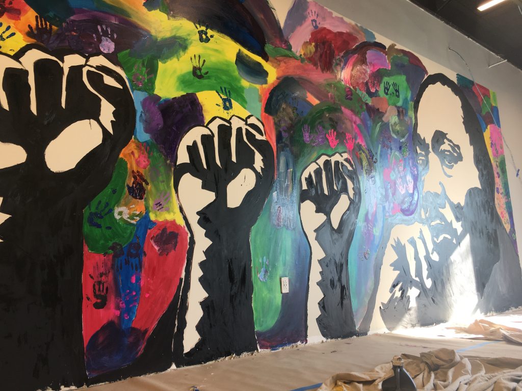 IMG_6435 A new mural honoring Dr. Martin Luther King Jr. was finished by student volunteers at The Warehouse, a new teen center opening soon in northeast Wilmington. (Mark Eichmann/WHYY)