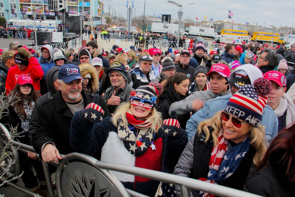 Image from iOS (6) Helena Mantovani (center) of Chester County makes it to her fourth Trump rally at the Wildwoods Convention Center. (Emma Lee/WHYY)