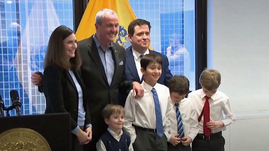 Kevin-Walsh Kevin Walsh and his family with Gov. Phil Murphy on Thursday. (NJTV News)