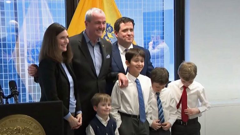 Kevin Walsh and his family with Gov. Phil Murphy on Thursday. (NJTV News)