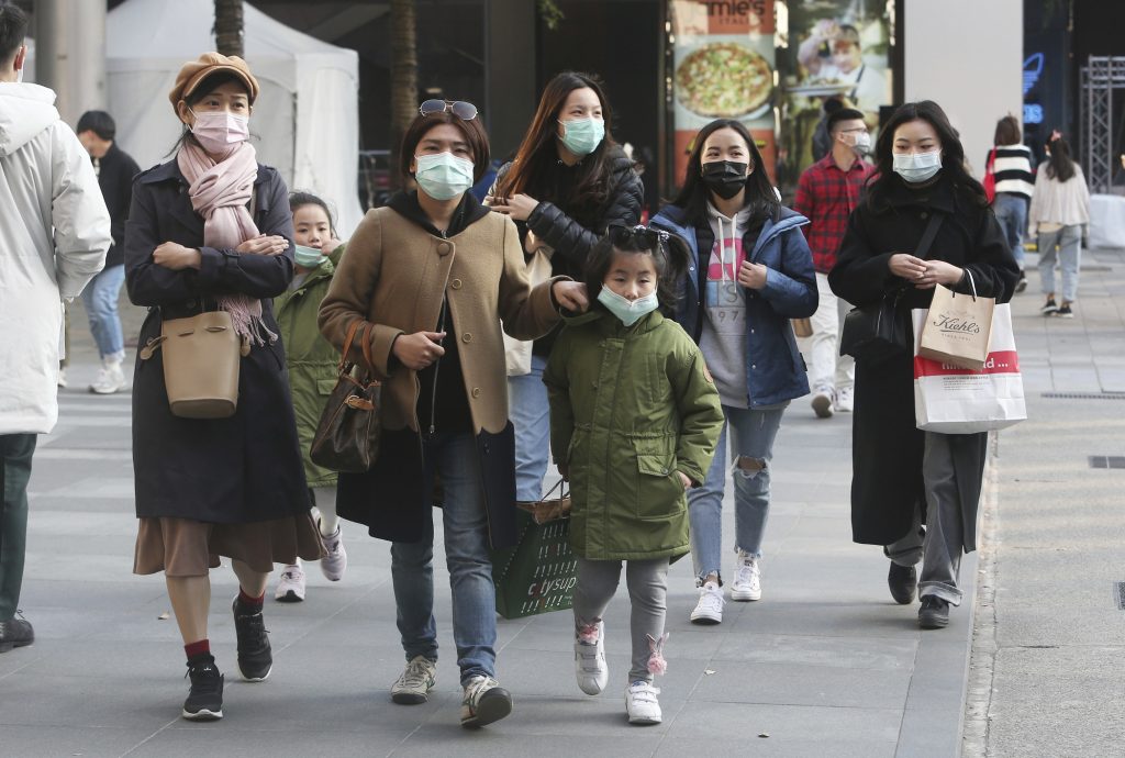 Taiwan New Coronavirus People wear face masks as they visit a shopping district in Taipei, Taiwan, Friday, Jan. 31, 2020. People wear face masks as they walk through a shopping mall in Taipei, Taiwan, Friday, Jan. 31, 2020. (AP Photo/Chiang Ying-ying)