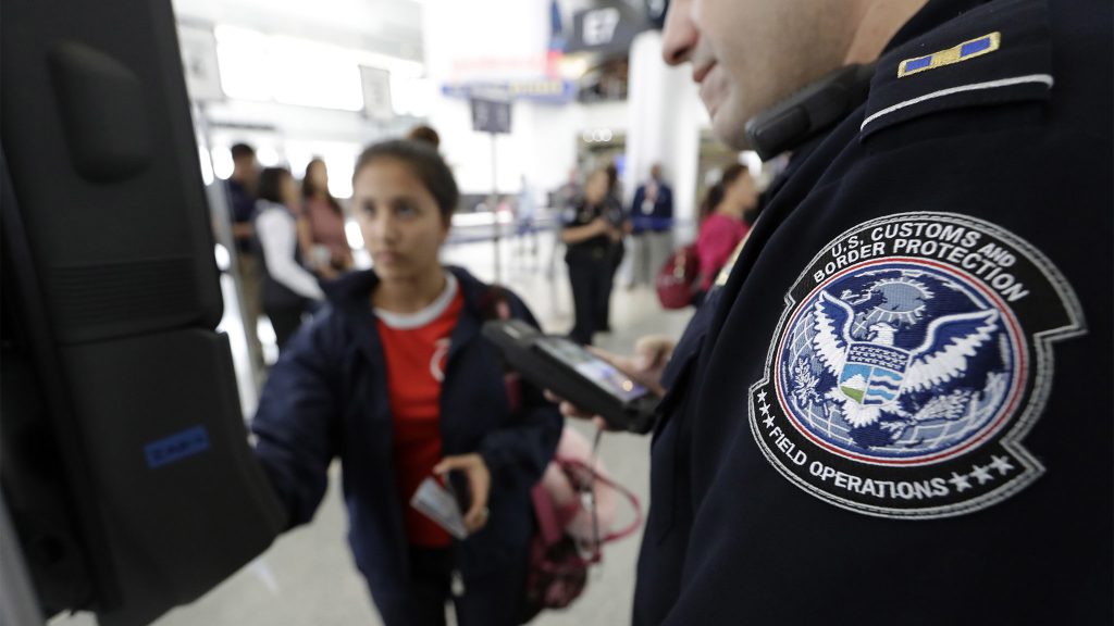 Julio Corro U.S. Customs and Border Protection officer Julio Corro, right, helps a passenger navigate one of the new facial recognition kiosks at a United Airlines gate before boarding a flight to Tokyo, Wednesday, July 12, 2017, at George Bush Intercontinental Airport, in Houston. The Trump administration intends to require that American citizens boarding international flights submit to face scans, something Congress has not explicitly approved and privacy advocates consider an ill-advised step toward a surveillance state. (AP Photo/David J. Phillip)