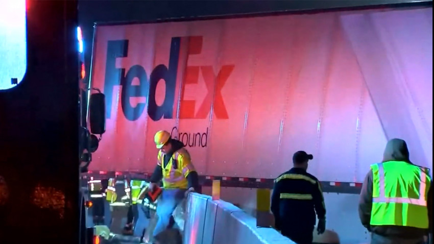 fatal-pa-turnpike-crash-01052019 Workers in vests near a crashed FedEx truck after a fatal accident on the Pennsylvania Turnpike. (NBC Philadelphia)