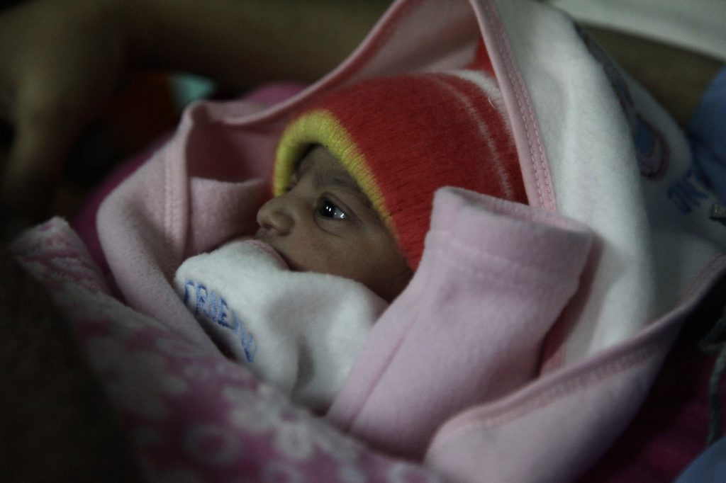 A 5-pound newborn girl is swaddled in a blanket in a hospital in Islamabad, Pakistan. She was born on Jan. 1, 2020. A 5-pound newborn girl is swaddled in a blanket in a hospital in Islamabad, Pakistan. She was born on Jan. 1, 2020. (Diaa Hadid)