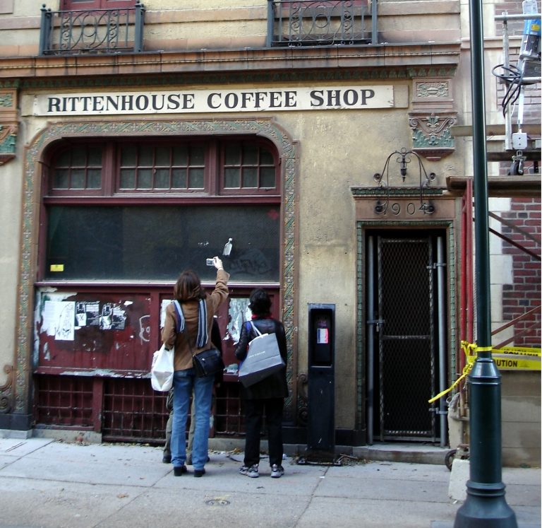 Two curious passersby study the former Rittenhouse Coffee Shop building at 1904 Sansom Street in 2005. (Elston via Flickr)