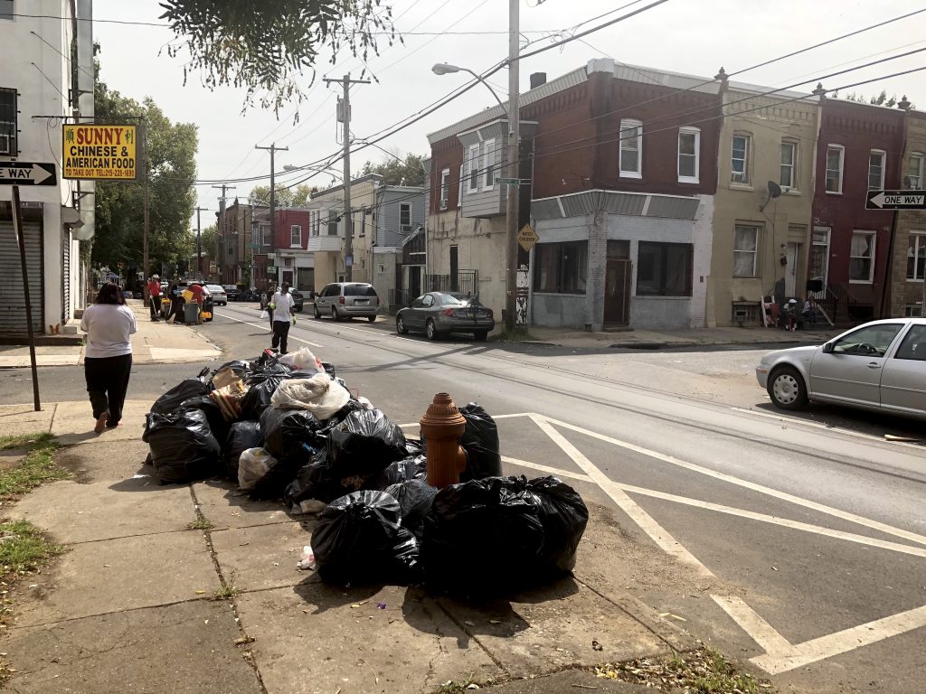 street cleaners in north philly Street cleaners organized by the Black Male Community Council of Philadelphia work on a North Philadelphia block. (Black Male Community Council of Philadelphia)