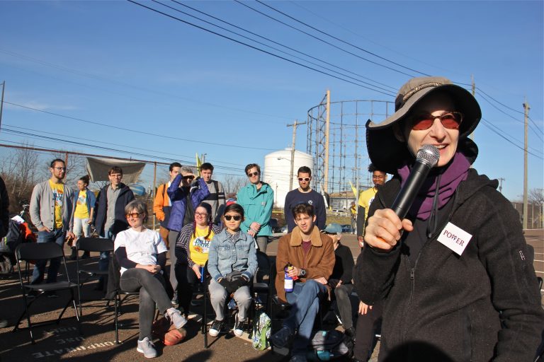 Rabbi Julie Greenberg rallies protesters during a daylong action at PES refinery in South Philadelphia. (Emma Lee/WHYY)