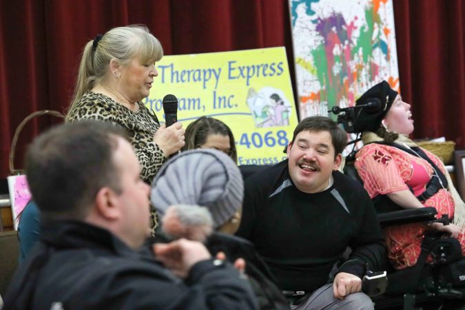 Cindy and Dillon Starkey give remarks during during an art therapy exhibit on Feb. 10, 2020, at The Art Studio in Wilmington, Del. (Saquan Stimpson for WHYY)