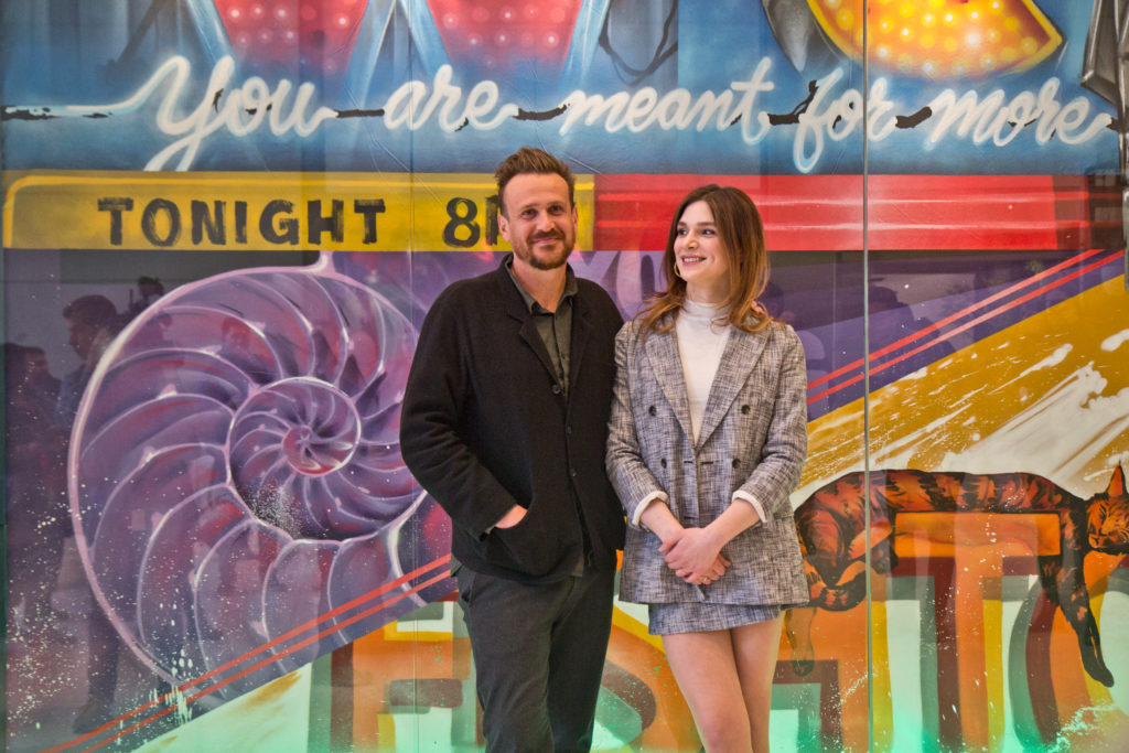 2020 2 28 k paynter jason segel-2 “Dispatches From Elsewhere” stars Eve Lindley (right) and Jason Segel (left) pose with local street artist Jimmy McMenamin's new mural at the Comcast Center. (Kimberly Paynter/WHYY)