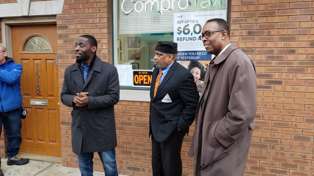 20200207_143241 Councilmembers Isaiah Thomas (left) and Darrell Clarke (right) with ComproTax owner Timothy Nelson. (Tom MacDonald/WHYY)