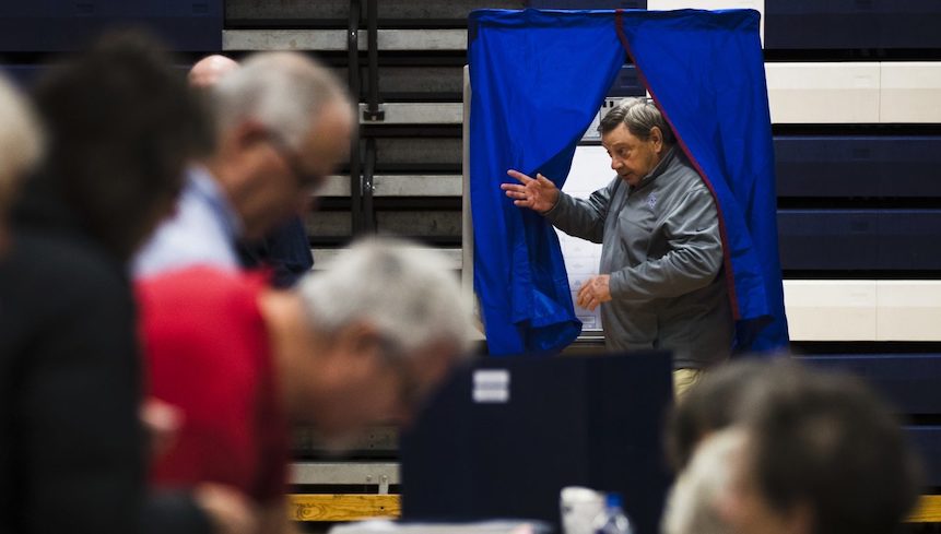AP_18310448649435-e1548804278616-1920×782 A voter steps from the voting booth after casting his ballot in Doylestown, Pa., Tuesday, Nov. 6, 2018. (Matt Rourke/AP Photo)