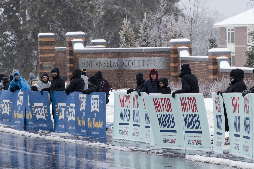 Election 2020 Debate Supporters of Democratic presidential candidate former South Bend, Ind., Mayor Pete Buttigieg and Democratic presidential candidate Sen. Elizabeth Warren, D-Mass., gather outside Saint Anselm College, Friday, Feb. 7, 2020, ahead of a Democratic party debate in Manchester, N.H. (AP Photo/Matt Rourke)