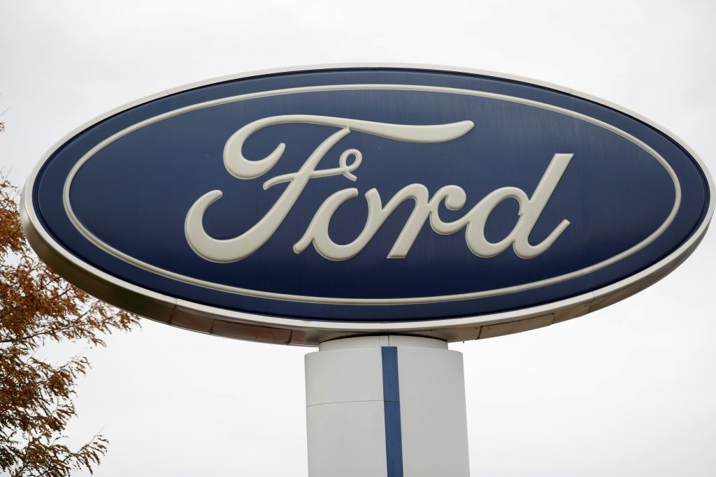 Ford Recall FILE - In this Oct. 20, 2019, file photo, the company logo stands over a long row of unsold vehicles at a Ford dealership in Littleton, Colo. (AP Photo/David Zalubowski, File)