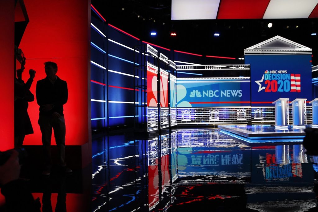 Election 2020 Debate People stand on stage during setup for the Nevada Democratic presidential debate Tuesday, Feb. 18, 2020, in Las Vegas. (AP Photo/John Locher)