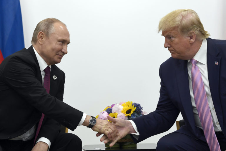 President Donald Trump, right, shakes hands with Russian President Vladimir Putin, left, during a bilateral meeting on the sidelines of the G-20 summit in Osaka, Japan, Friday, June 28, 2019. (Susan Walsh/AP Photo)