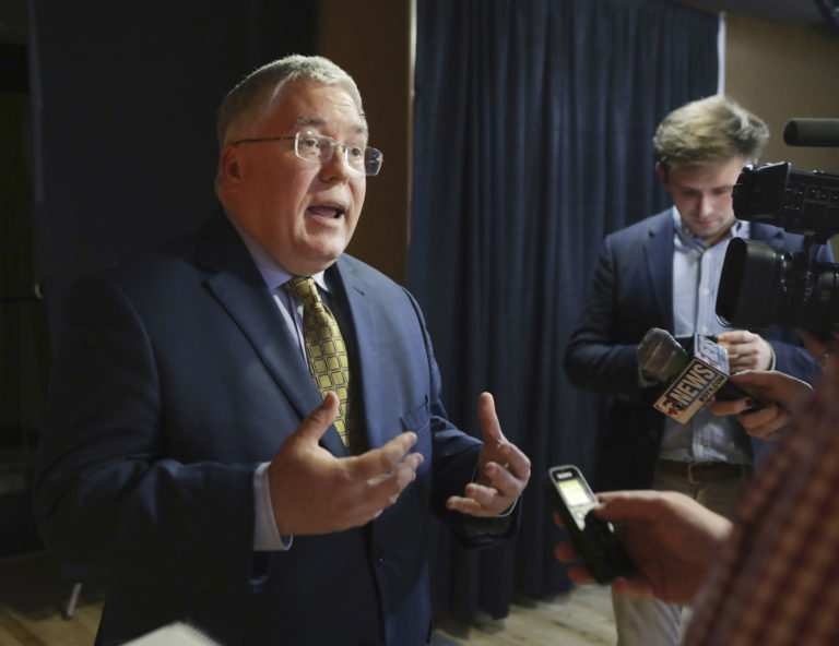 Patrick Morrisey speaks to reporters after a debate in Morgantown, W.Va. State attorneys general are finding a national settlement over the toll of opioids to be elusive, as some lawyers for state and local governments are renewing public criticism of the proposed deal with a group of companies led by the nation's largest drug distributors. (Raymond Thompson, File, AP Photo)