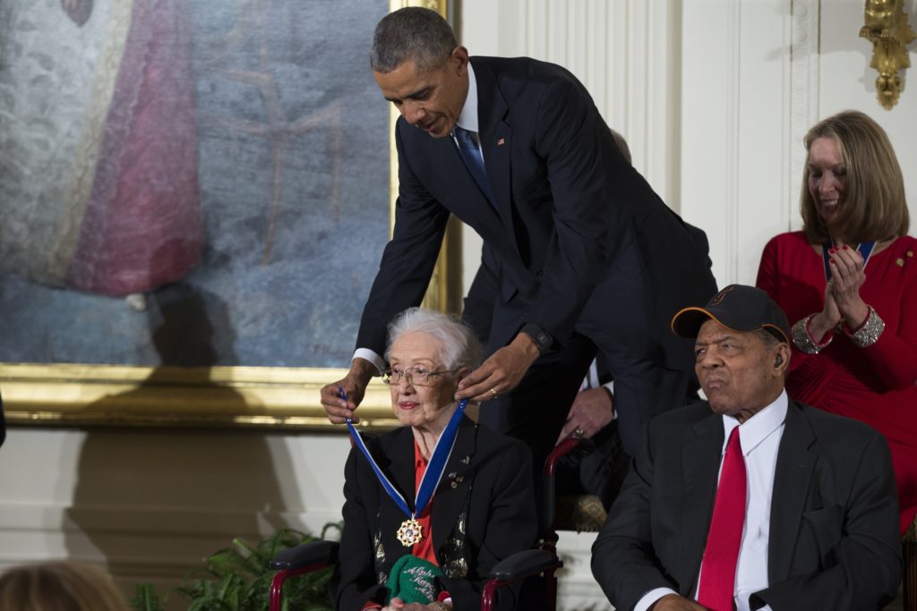 Barack Obama, Katherine Johnson, Willie Mays FILE-In this Tuesday, Nov. 24, 2015 photo, Willie Mays, right, looks on as President Barack Obama presents the Presidential Medal of Freedom to NASA mathematician Katherine Johnson during a ceremony in the East Room of the White House, in Washington. Johnson, a mathematician on early space missions who was portrayed in film “Hidden Figures,” died Feb. 24, 2020. (AP Photo/Evan Vucci)