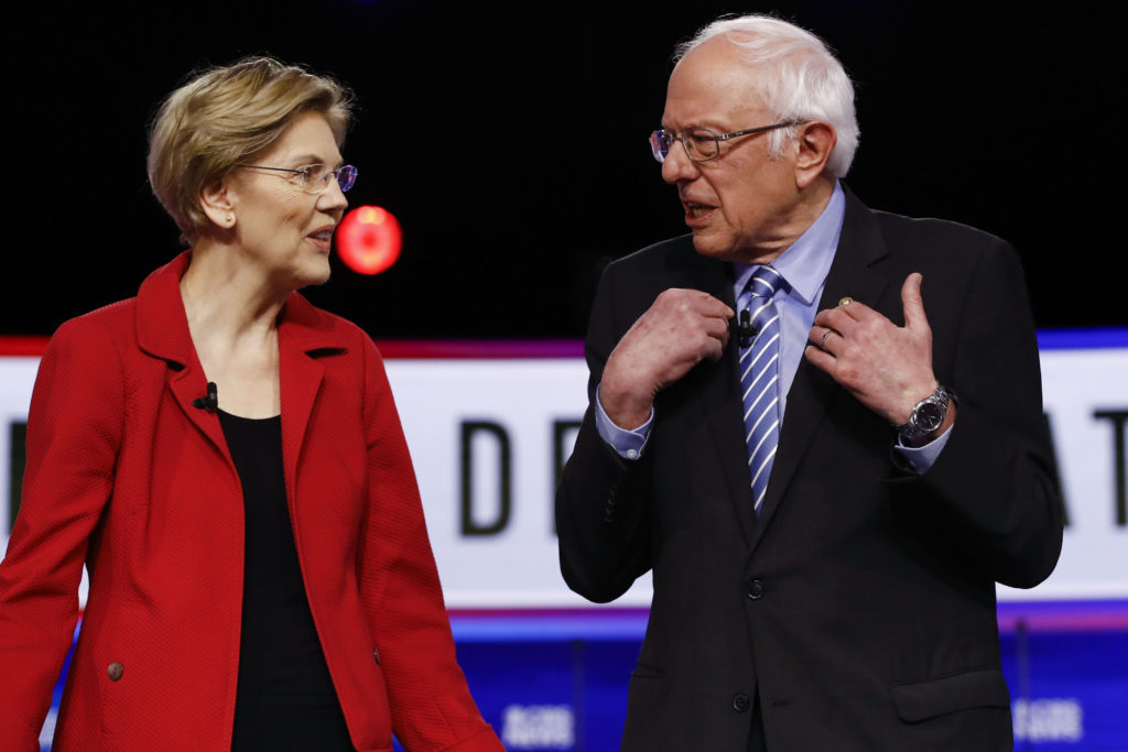 Elizabeth Warren, Bernie Sanders Democratic presidential candidates, Sen. Elizabeth Warren, D-Mass., and Sen. Bernie Sanders, I-Vt., talk before a Democratic presidential primary debate, Tuesday, Feb. 25, 2020, in Charleston, S.C. (AP Photo/Matt Rourke)