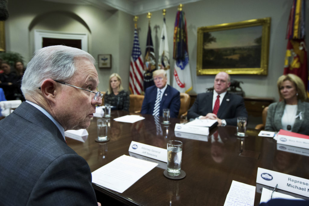 Donald Trump, Jeff Sessions, Kirstjen Nielsen, Thomas Homan, Mary Ann Mendoza Attorney General Jeff Sessions, left, speaks during a roundtable talks on sanctuary cities hosted by President Donald Trump in the Roosevelt Room of the White House, in Washington, Tuesday, March 20, 2018. Other attendees are, from back center left, Homeland Security Secretary Kirstjen Nielsen, Trump, Immigration and Customs Enforcement Acting Director Thomas Homan and Mary Ann Mendoza. (AP Photo/Manuel Balce Ceneta)