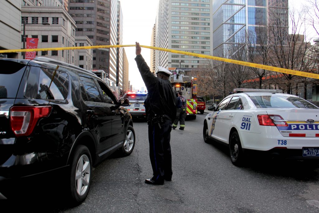 Police shut down JFK Boulevard at 17th Street after a report of an active shooter in the Sterling apartments. (Emma Lee/WHYY)
