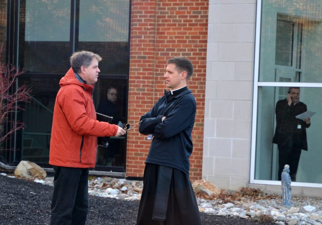 Larlick-crop-one-e1582167391397-1920×984 (1) At left, the Rev. Matthew Larlick of St. Joseph’s in Berwick, Columbia County, speaks with another priest outside the Harrisburg diocese office after a meeting Wed., Feb. 19, 2020. (Brett Sholtis/WITF)