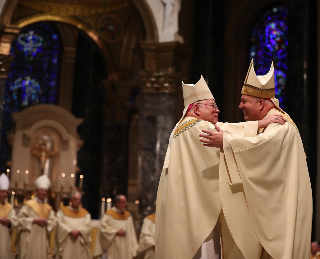 PEREZ19-D Archbishop Charles J. Chaput (left) embraces Archbishop Nelson J. Pérez (right) during his installation at the Cathedral Basilica of Saints Peter and Paul in Philadelphia on February 18, 2020. (Pool photo/ by David Maialetti/The Philadelphia Inquirer)