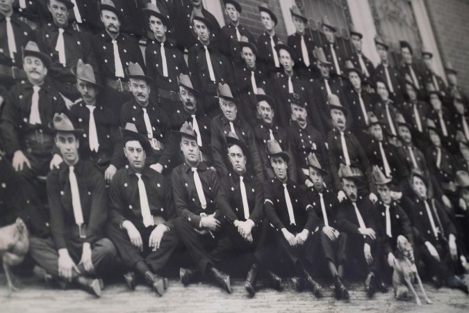 A photograph of the company of firefighters taken in the early 20th century is displayed at Good Will Fire Company No. 4 in Pottsville, Pennsylvania. (Matt Smith for Keystone Crossroads)