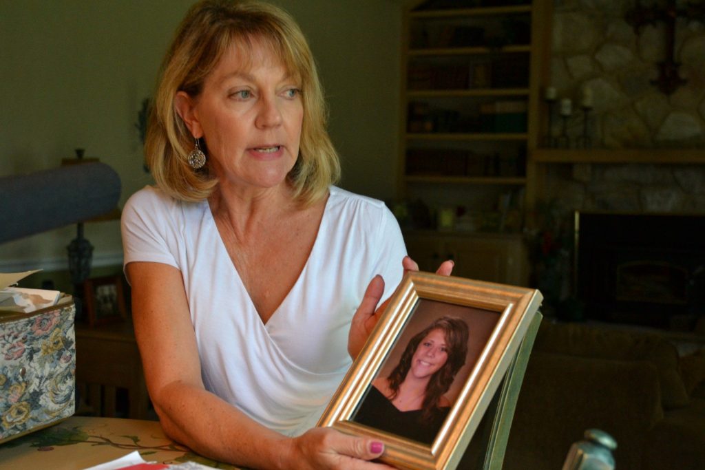 Stringers2-1920×1280 Martha Stringer holds a photo of her daughter, Kim, from when she was in high school. Kim lives with a serious mental illness. Her parents have struggled to get Kim help, because Kim often refuses treatment. (Brett Sholtis / Transforming Health)