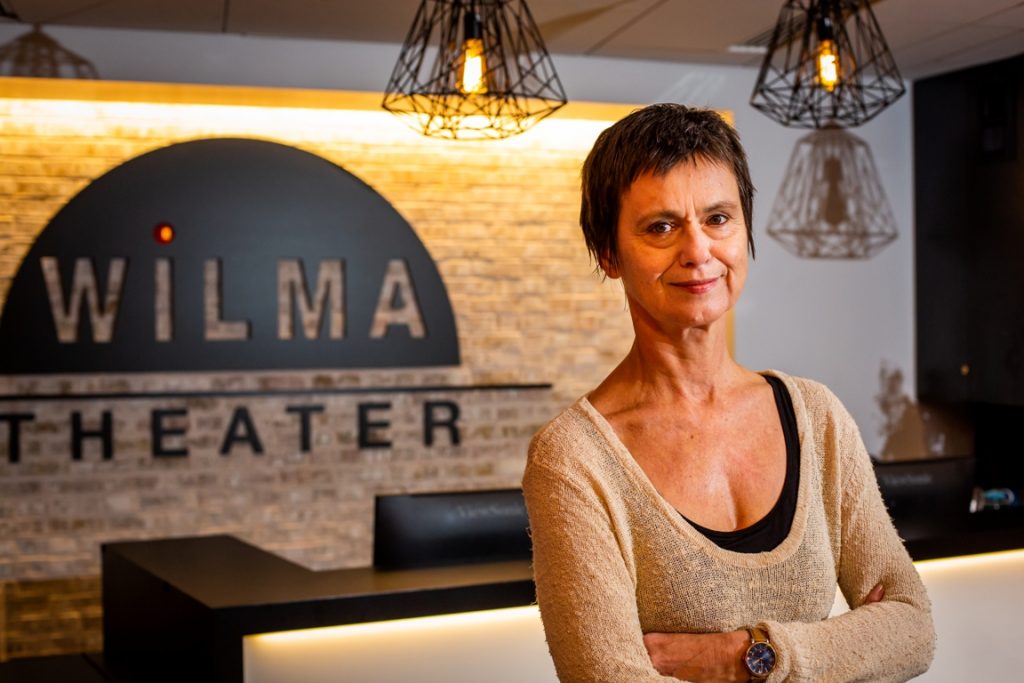 WILMA ART 2 Blanka Zizka stands in front of a Wilma Theater sign