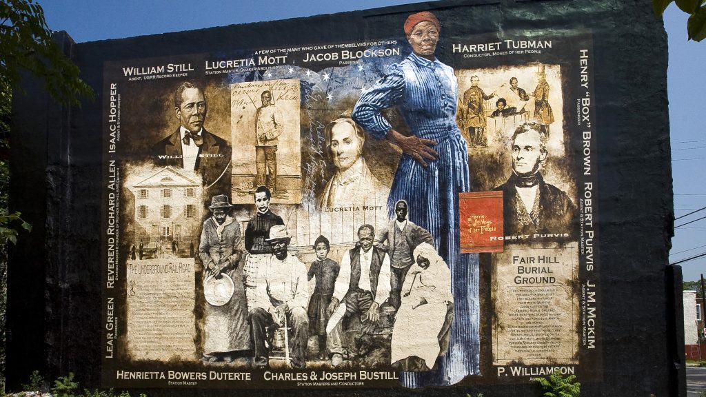 ART A mural on Germantown Avenue celebrates Harriett Tubman and other heroes of the Underground Railroad. (Mural Arts/ Painting by Sam Donovan, Photo by Jack Ramsdale)
