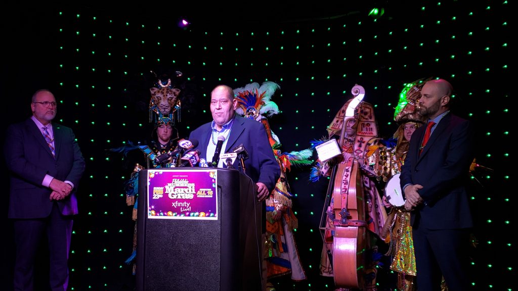 mummers pic John Pignotti (center) discusses self policing on blackface issue as members of the Quaker City String Band Look on (Tom MacDonald/WHYY)