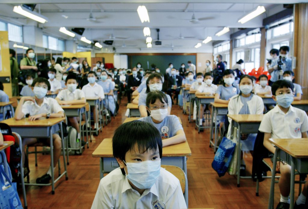 School was suspended for six weeks in Hong Kong as part of the strategy to keep SARS from spreading. On May 12, 2003, primary school children returned to class amid signs that the outbreak was coming under control. School was suspended for six weeks in Hong Kong as part of the strategy to keep SARS from spreading. On May 12, 2003, primary school children returned to class amid signs that the outbreak was coming under control. (Bobby Yip/Reuters)