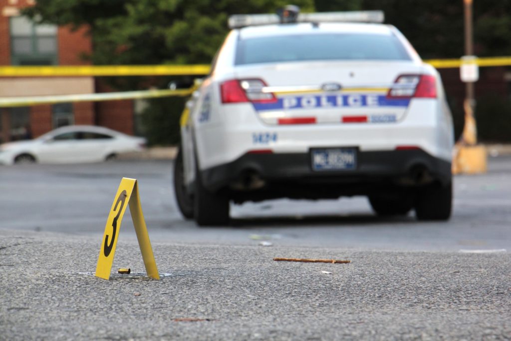 2018 10 03-e lee-philadelphia germantown dollar general-drive by shooting gun violence Police investigate a drive-by shooting in Germantown on Oct. 3, 2018. (Emma Lee/WHYY)