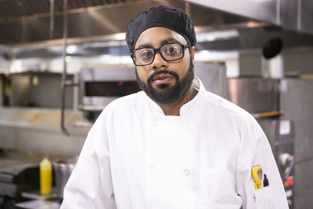 Hounds walk to help save others of their kind Chef Terrick Hubbard poses for a picture at a kitchen in Camden on Monday, March 9, 2020. (Miguel Martinez for WHYY)
